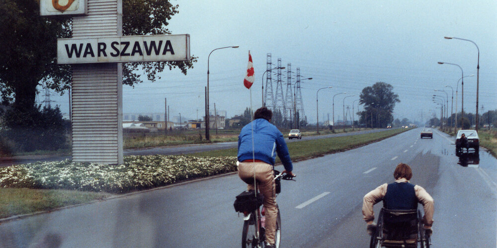 Man provides an escort back to the team's hotel after getting lost from a special event in Warsaw, Poland. 