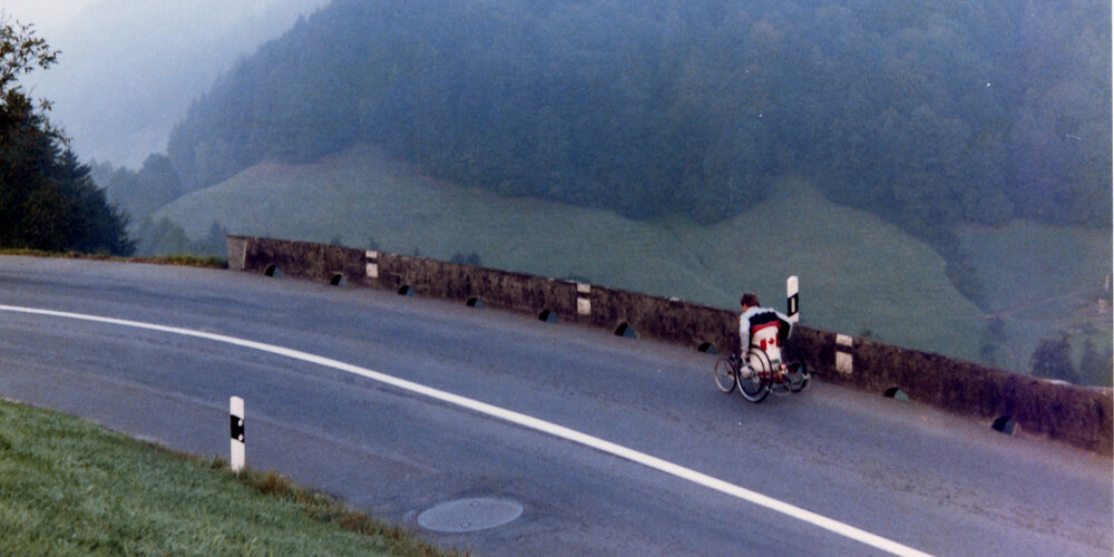 Rick Hansen wheeling up a steep grade in the Swiss Alps during early October of 1985.