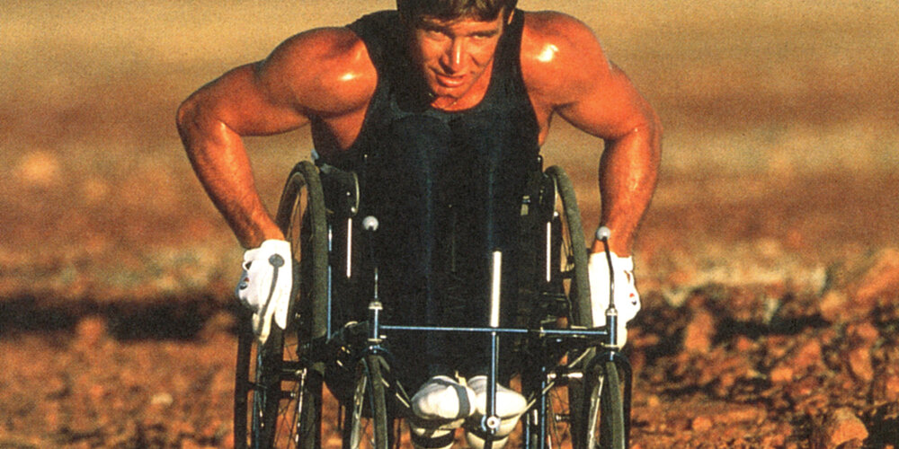 Rick Hansen wheeling in the Australian Outback.