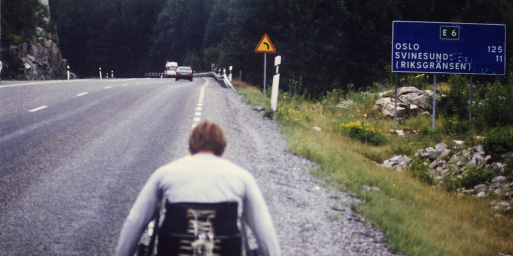 Rick Hansen wheeling in Norway eleven kilometers outside of Svinesund, Norway during August 1985. 