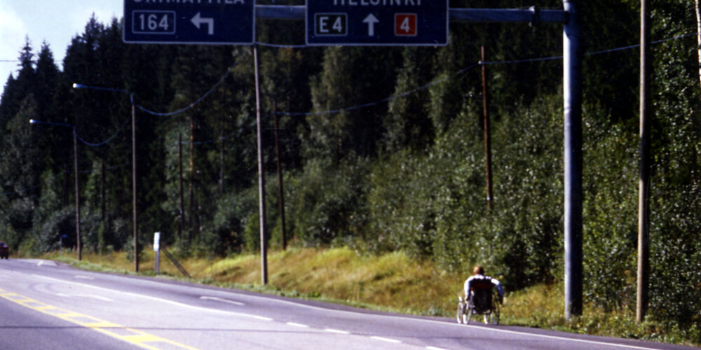 Rick Hansen wheeling into Helsinki, Finland during August of 1985.