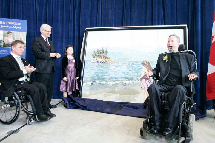 People presenting a piece of painting