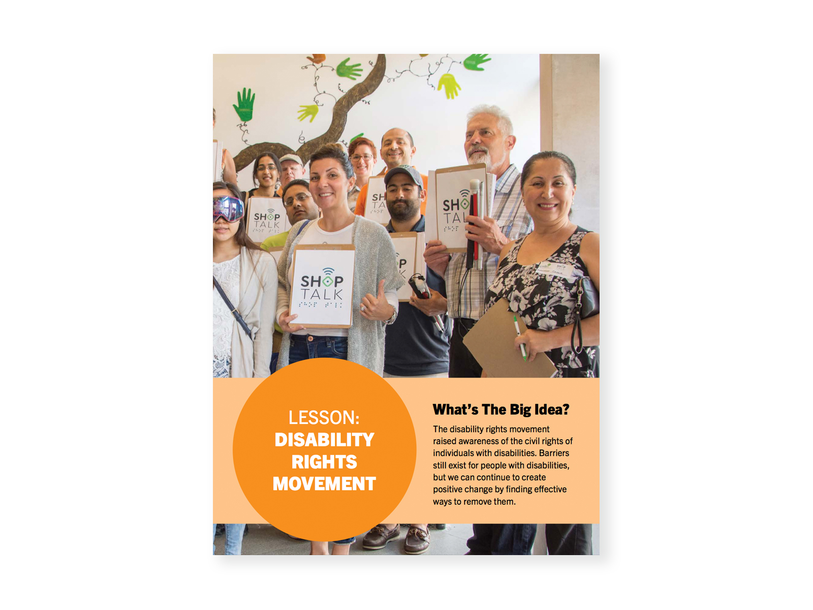 A group of people holding up signs celebrating the launch of the Shop Talk BlindSquare Enabled Neighbourhood app. Cover for "Disability Rights Movement" lesson.