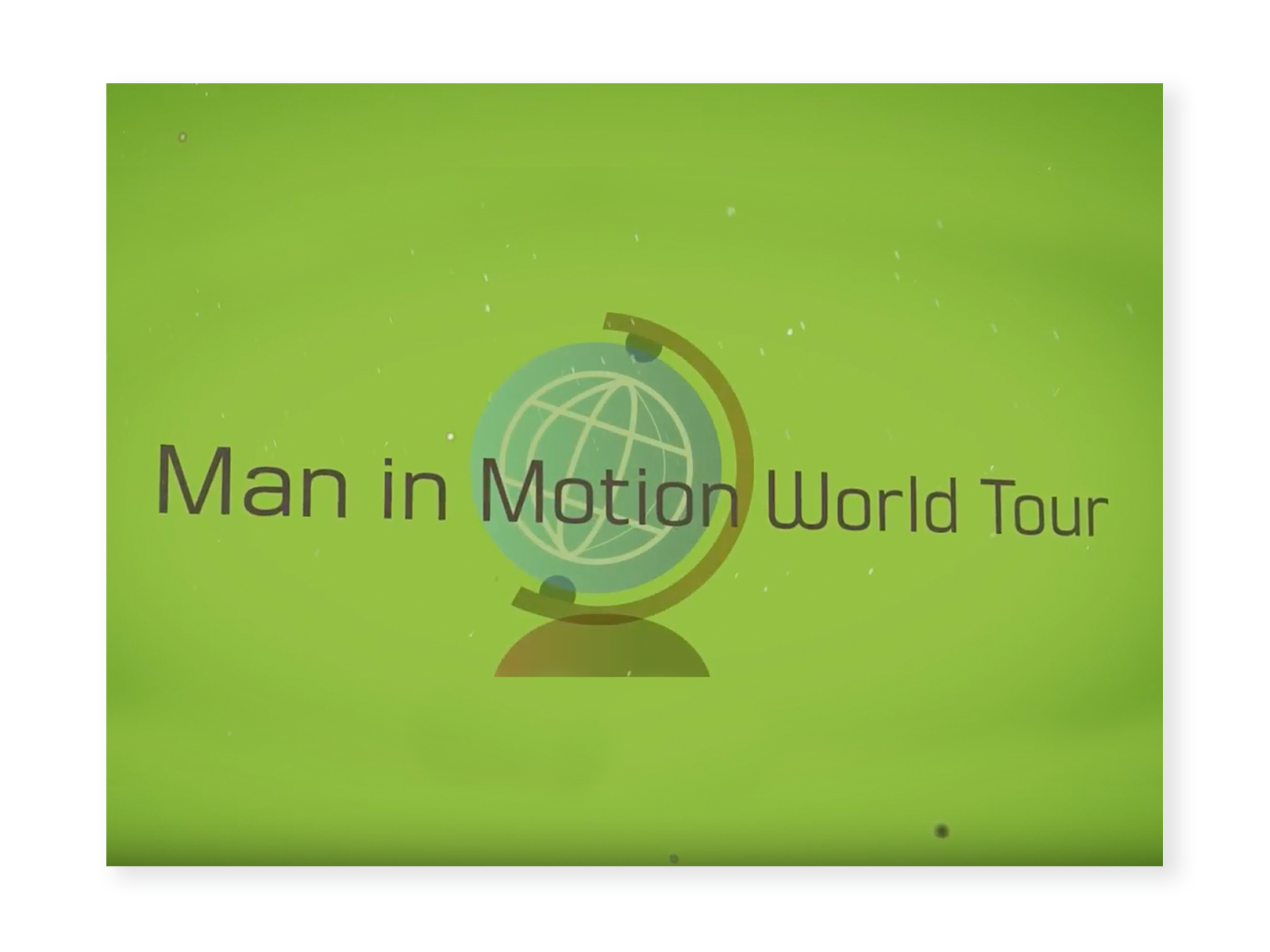Screenshot from "Man in Motion World Tour" video - green background with a graphic of a globe. The words "Man in Motion World Tour" are overlayed.