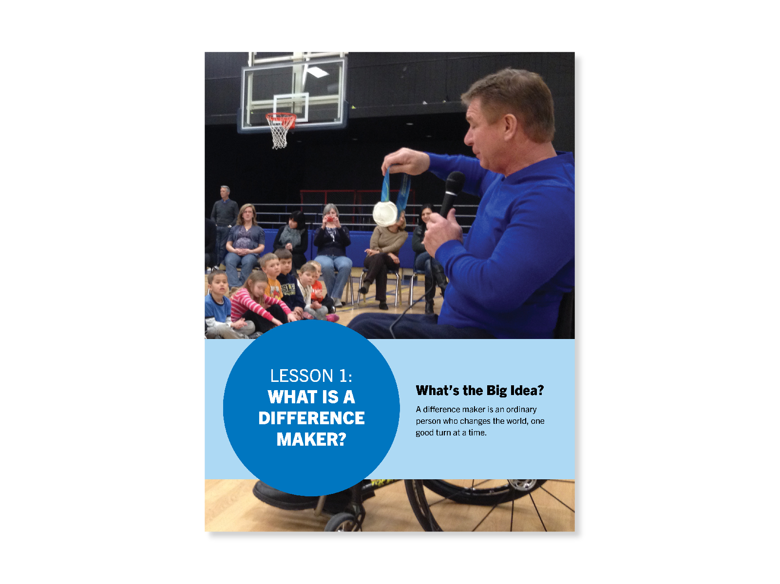 Rick Hansen shows a medal to students in a basketball court. Cover for Lesson 1: What is a Difference Maker?