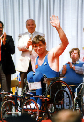Rick Hansen on his wheelchair waving at his supporters during his Man In Motion World Tour.