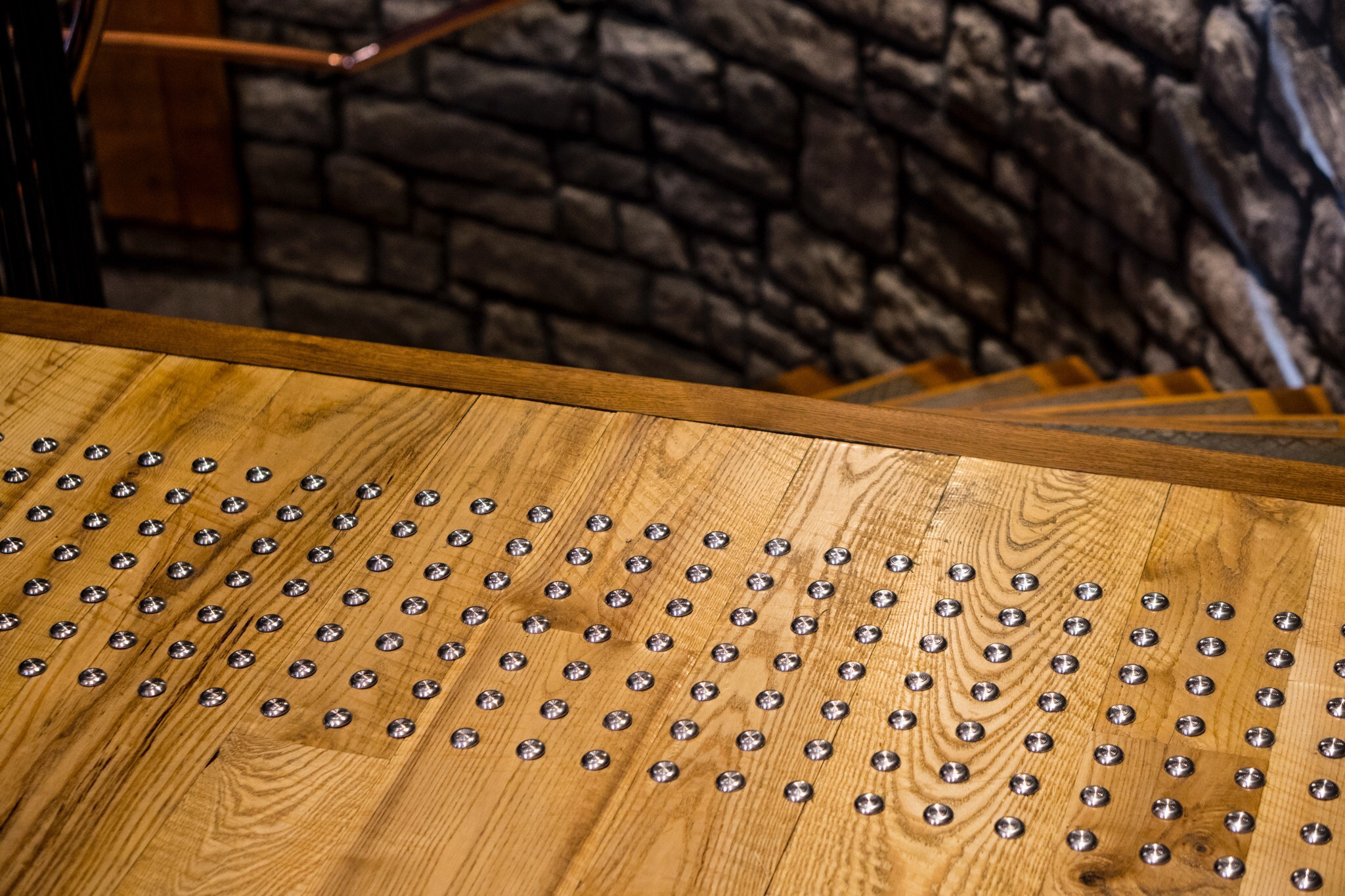 textured floor indicates the start of a flight of stairs for blind people