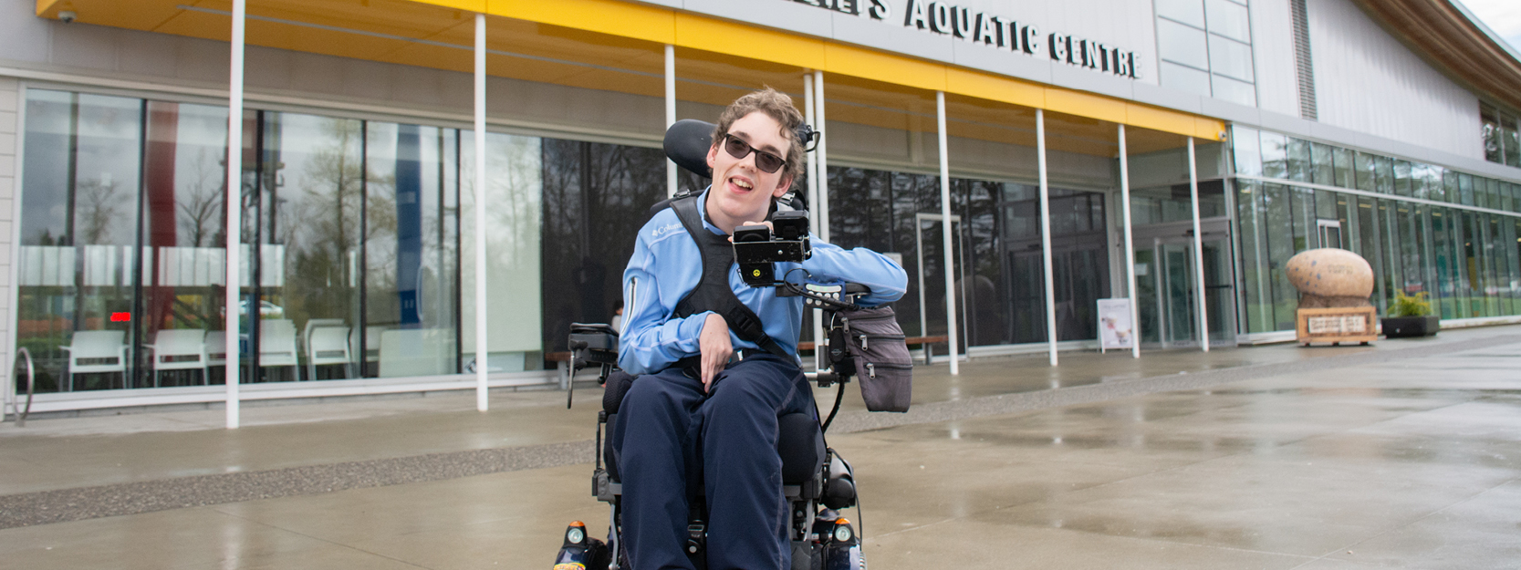 Wheelchair user outside of the Grandview Heights Aquatic Centre