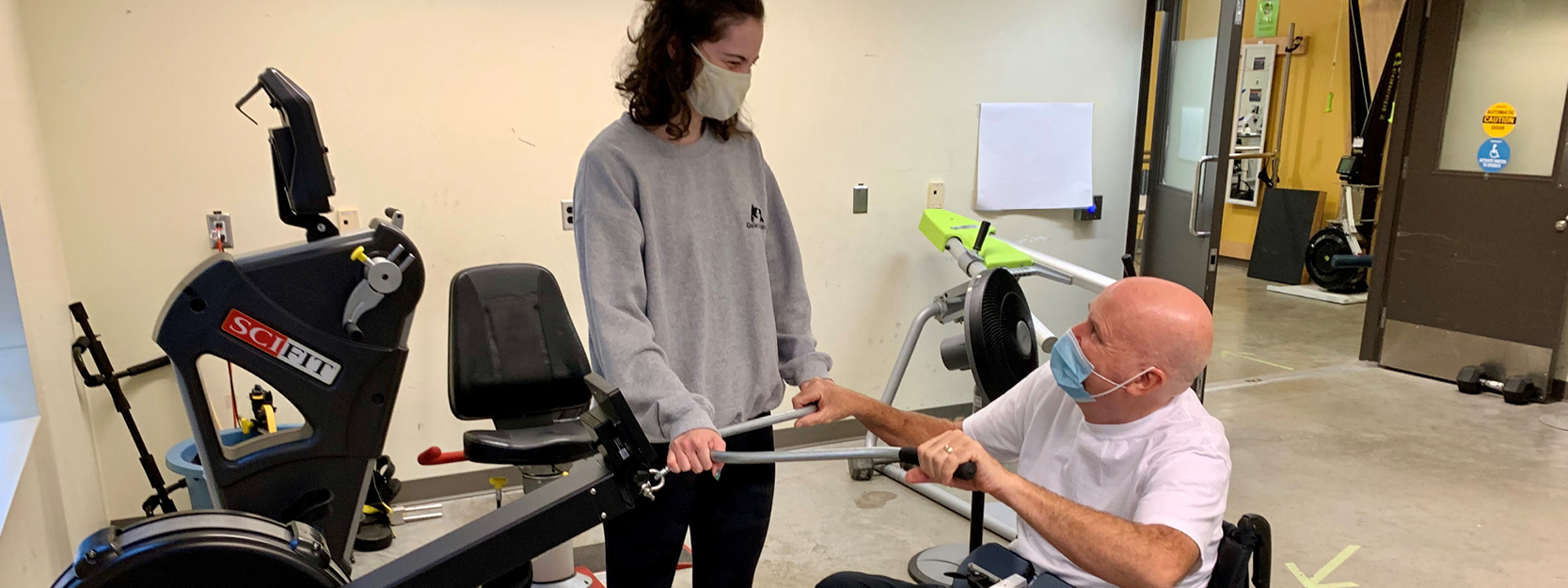 wheelchair user works out in an adaptive fitness centre