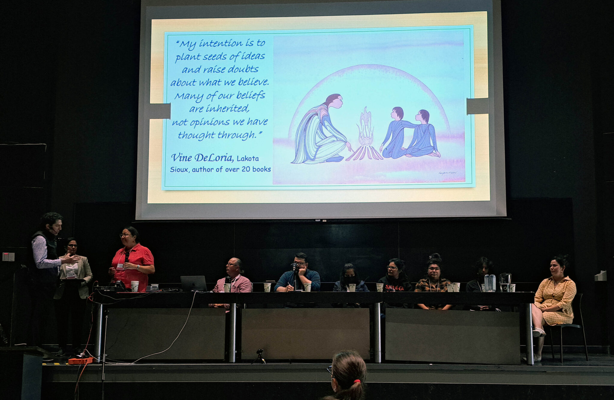 A group of people seating on a stage at the closing ceremony of the Montreal Convention on Friday, August 26, 2022, Professor Josie C. Auger, who teaches Native Studies at Athabasca University, offered insights into Indigenous knowledge. Auger, who teaches Native Studies at Athabasca University, offered insights into indigenous knowledge. She was joined by representatives from Vancouver (Grant Fahlgren), Sudbury (William Morin) and One House Many Nations in Manitoba (Professor Sylvia McAdam and her students).