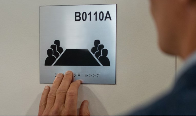 Braille on meeting room sign of a boardroom.