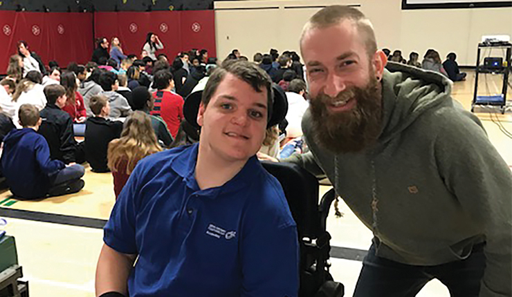 Boy using wheelchair in gym