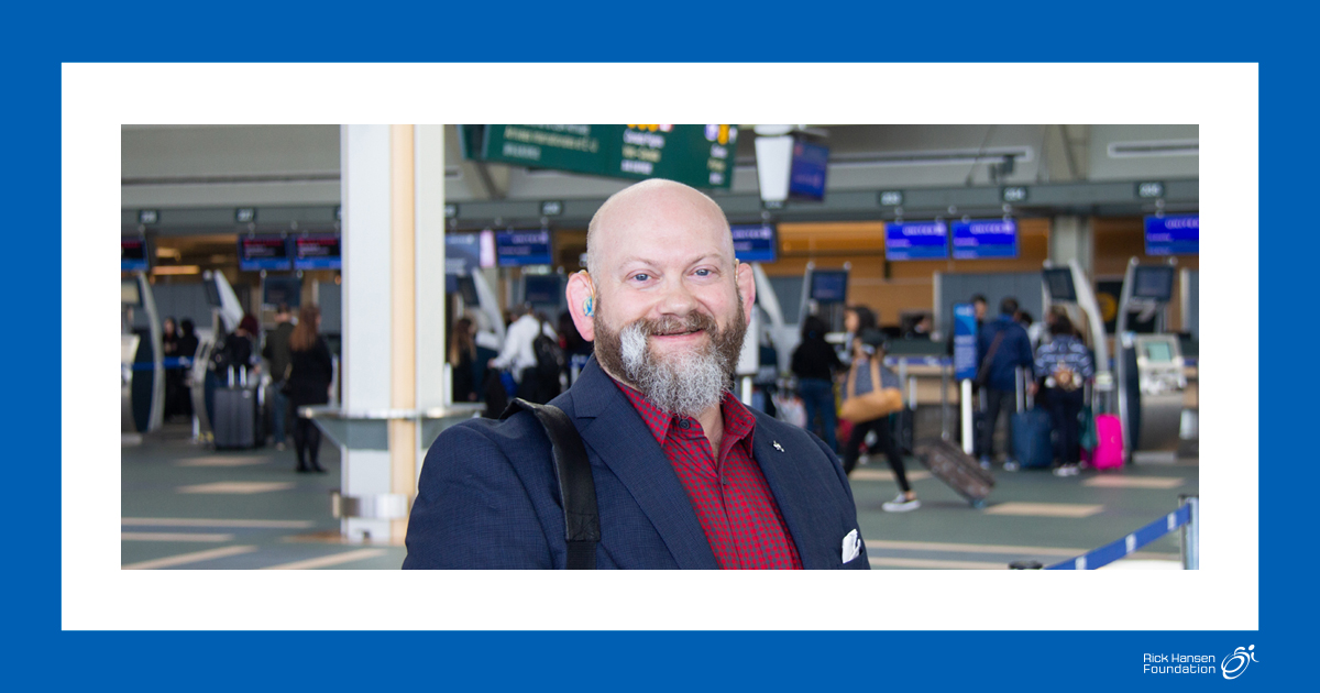 Man with hearing aids in airport