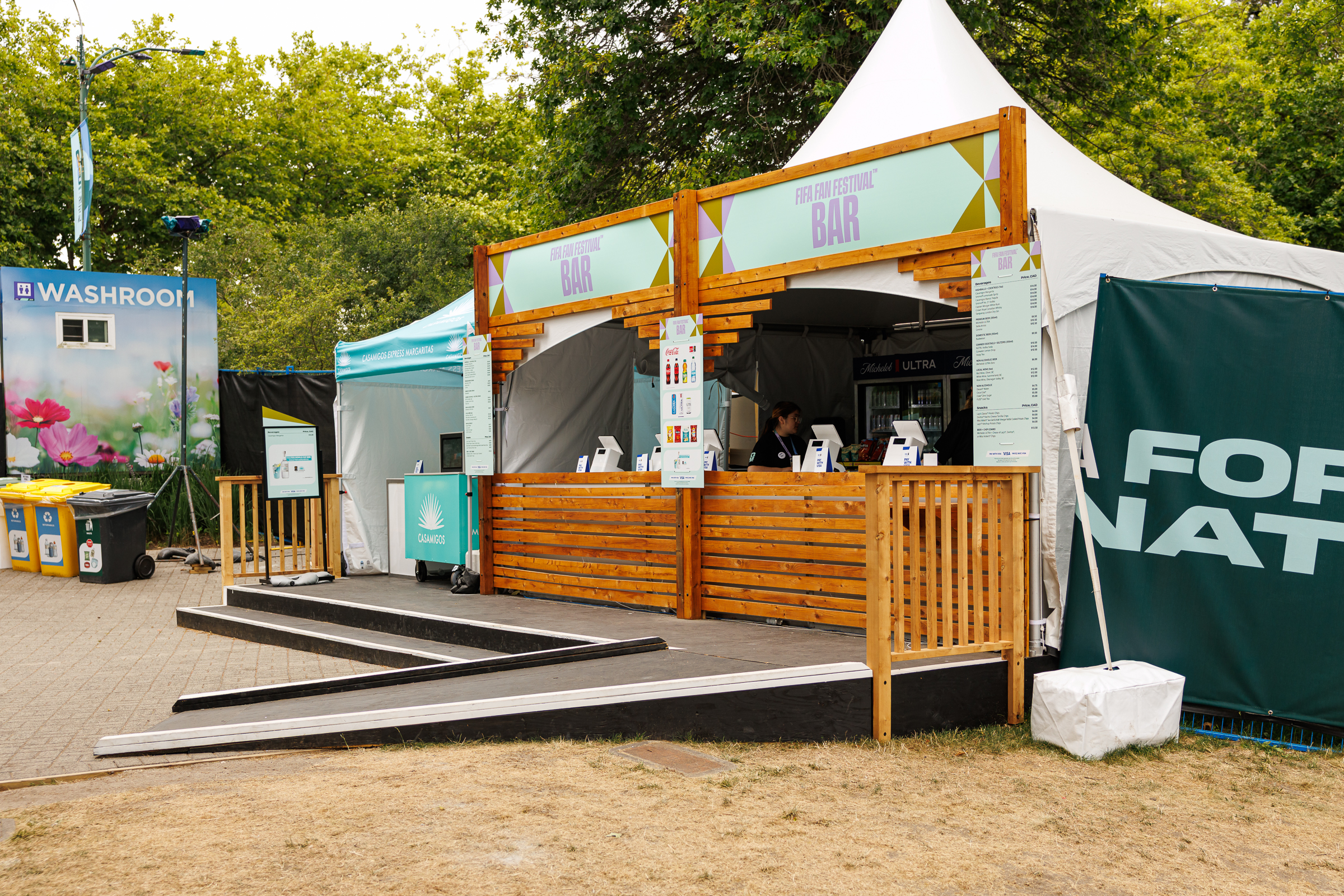 Festival bar with a wide access ramp leading to the service counter, providing step-free access for visitors.