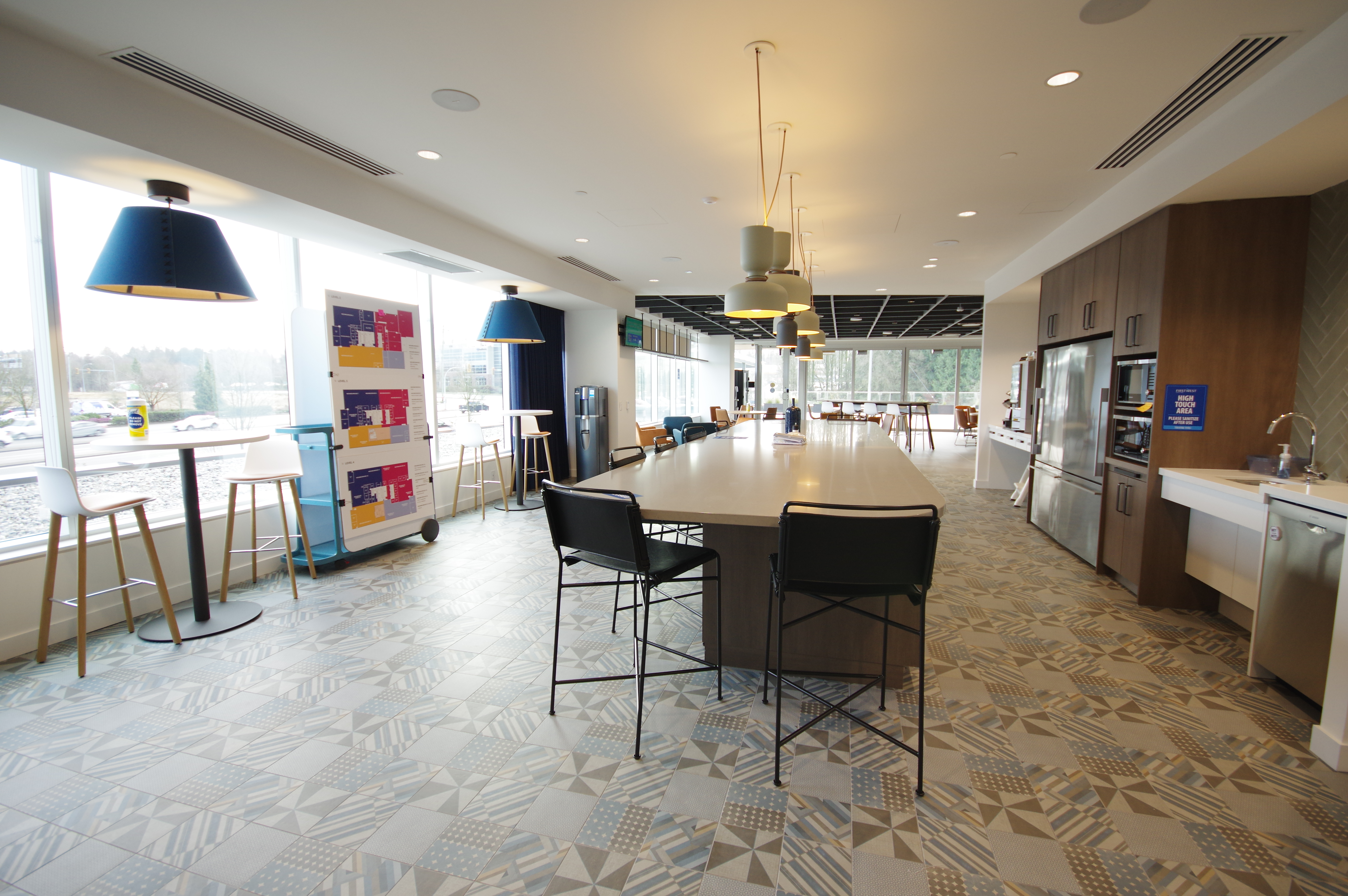 A perspective view of a staff lounge and kitchen at First West Credit Union