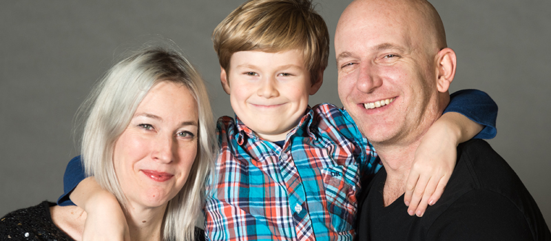 Teri, her son and husband, all smiling
