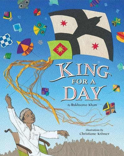 A cartoon boy using a wheelchair flying a large kite among many other kites. The title is written in white and red and reads king for a day.