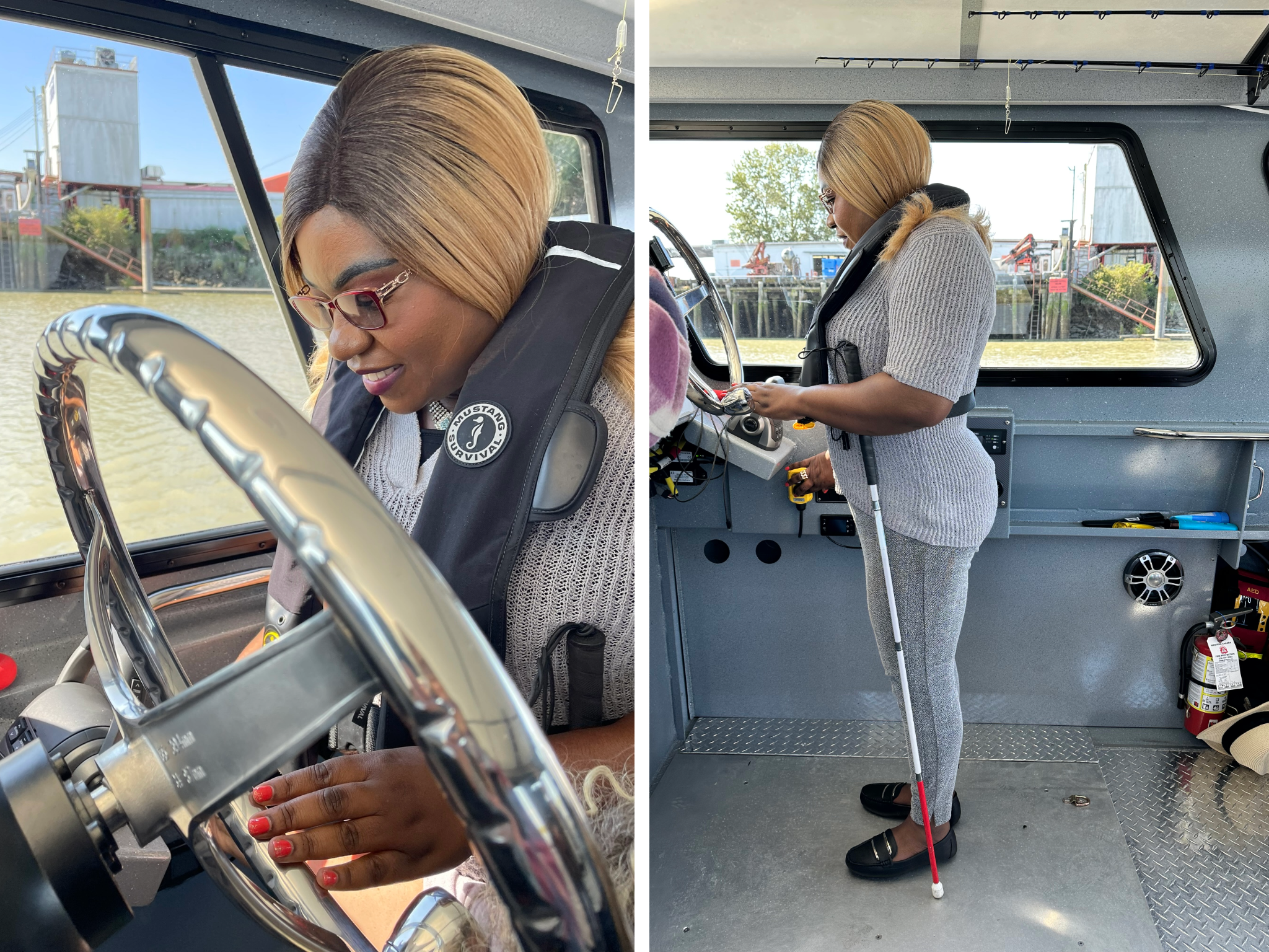 Smiling woman standing at the wheel of a boat while touching it, with a white cane resting beside her
