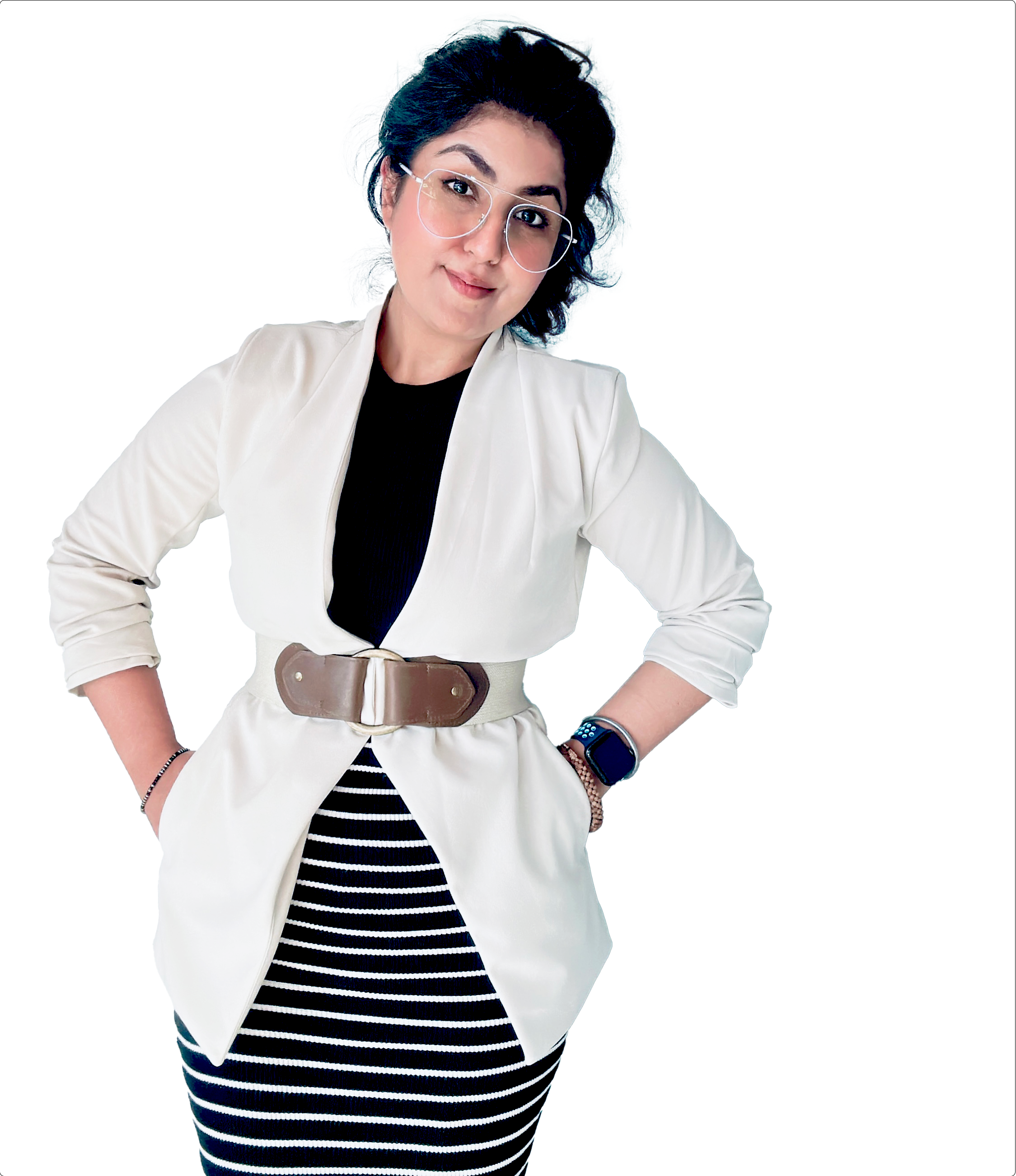 An adult woman wearing glasses and an elegant outfit, posed in a composed manner.