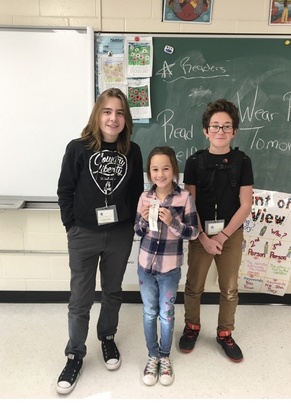 three people in a classroom