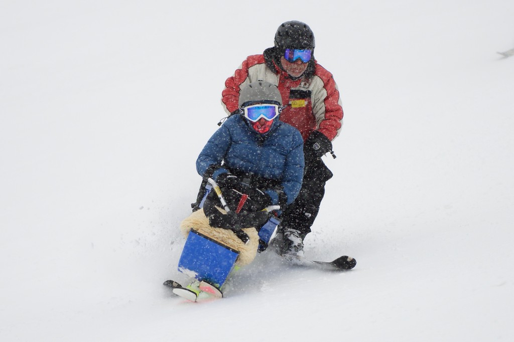 Julie uses adaptive skiing equipment