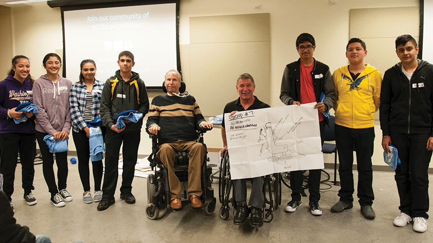Photo of Rick with the winning teams of the competition