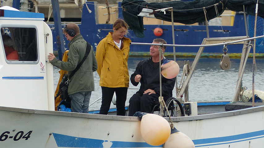 Rick and Ivana fishing for octopus on a boat.