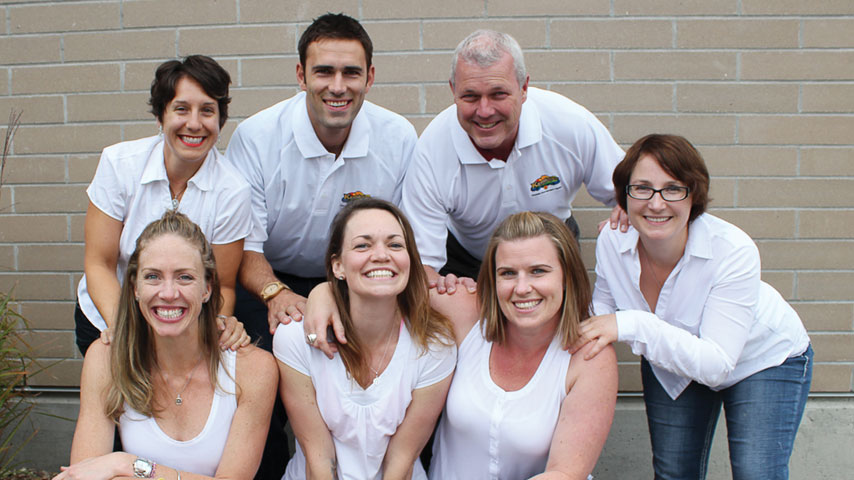 Group photo of people dressed in white.