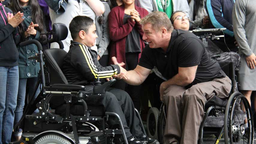 Rick greeting a student.