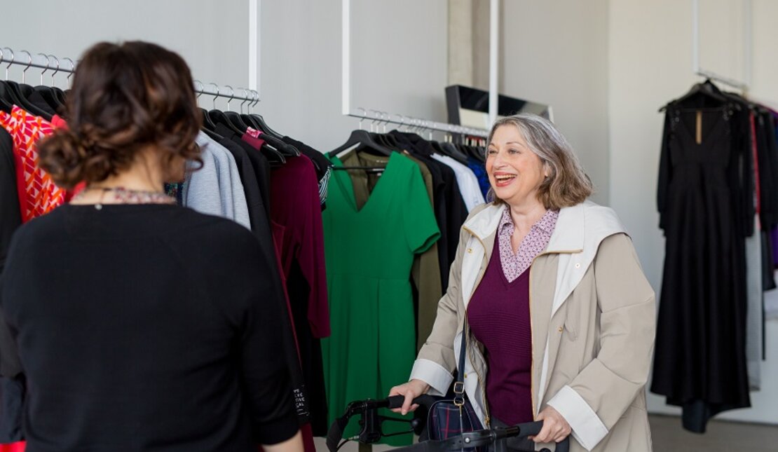 Woman walks through an accessible clothing store