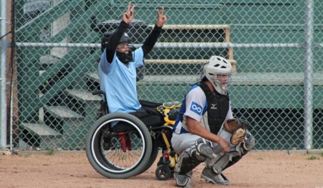 Trent Seymour playing fastball in his wheelchair