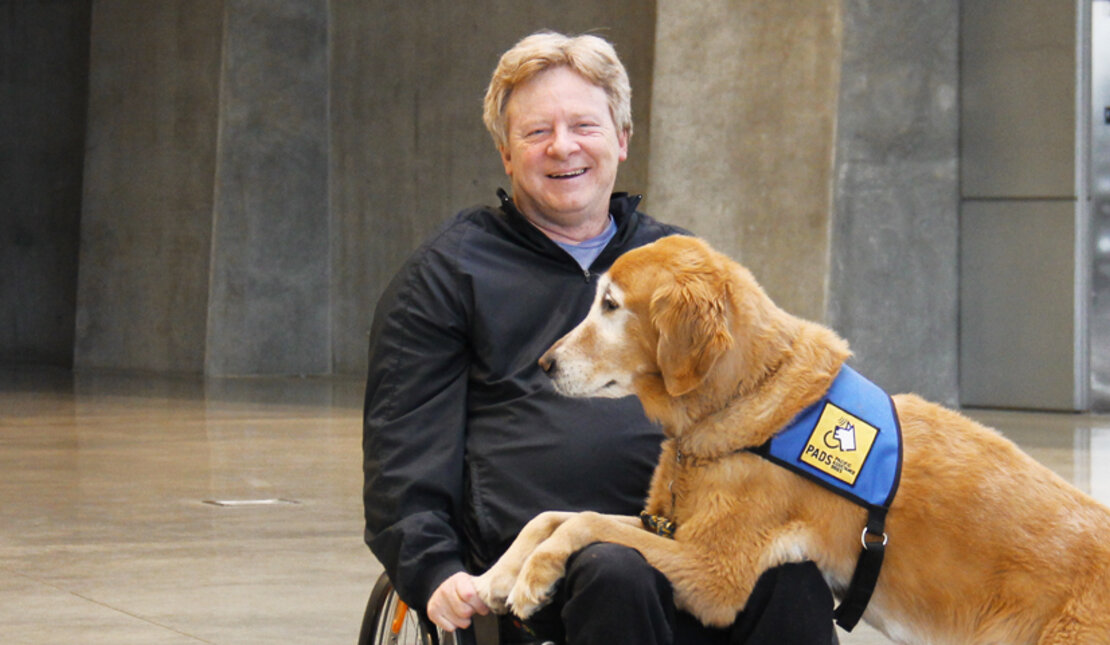 Brad McCannell and his service dog Chipper