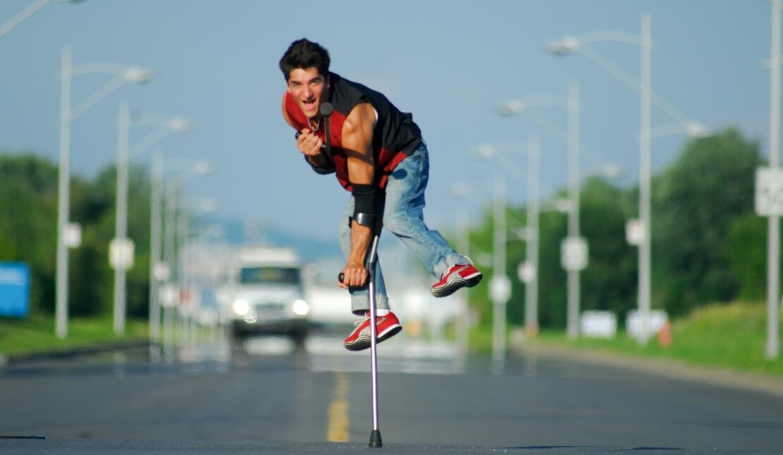 RHF Ambassador, Luca Lazylegz Patuelli in the middle of the street with incoming cars