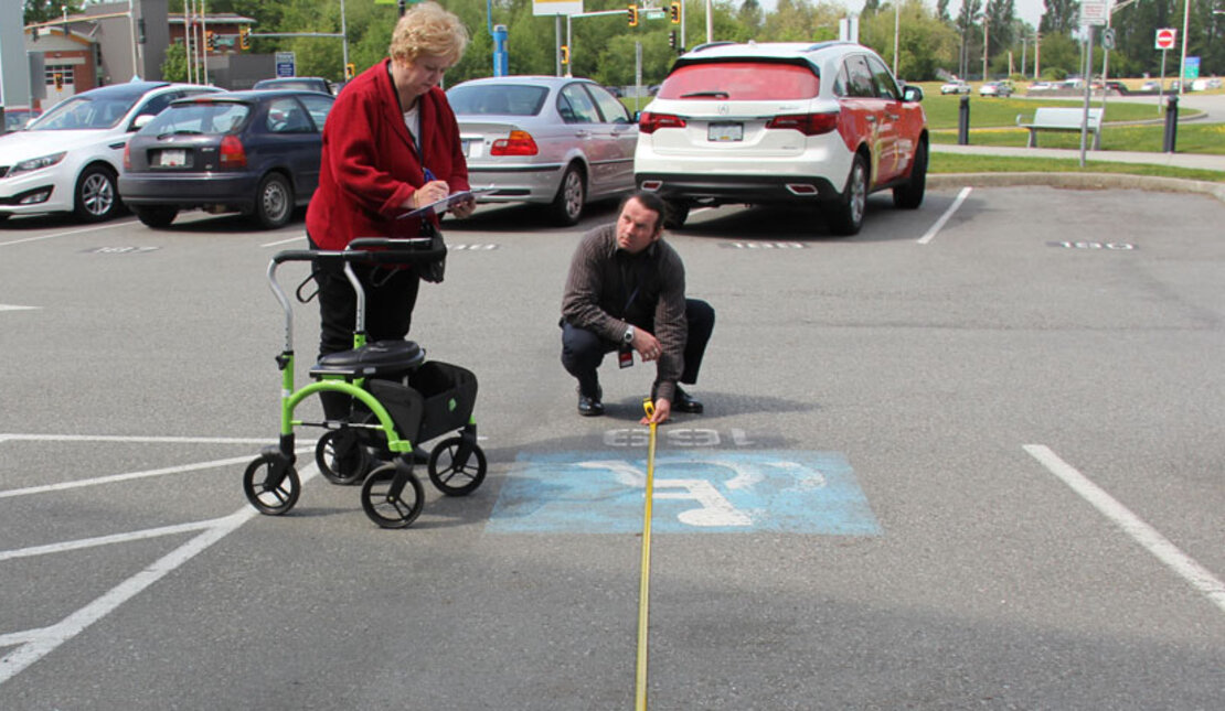 The Rick Hansen Foundation Accessibility Team at measuring parking stall accessibility