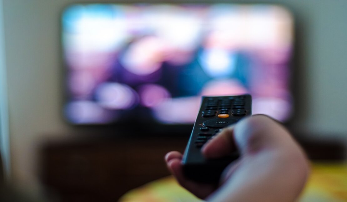 Person with vision impairments watching tv