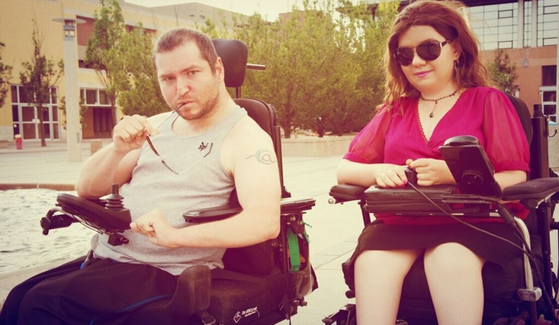 Photo of two people with disabilities