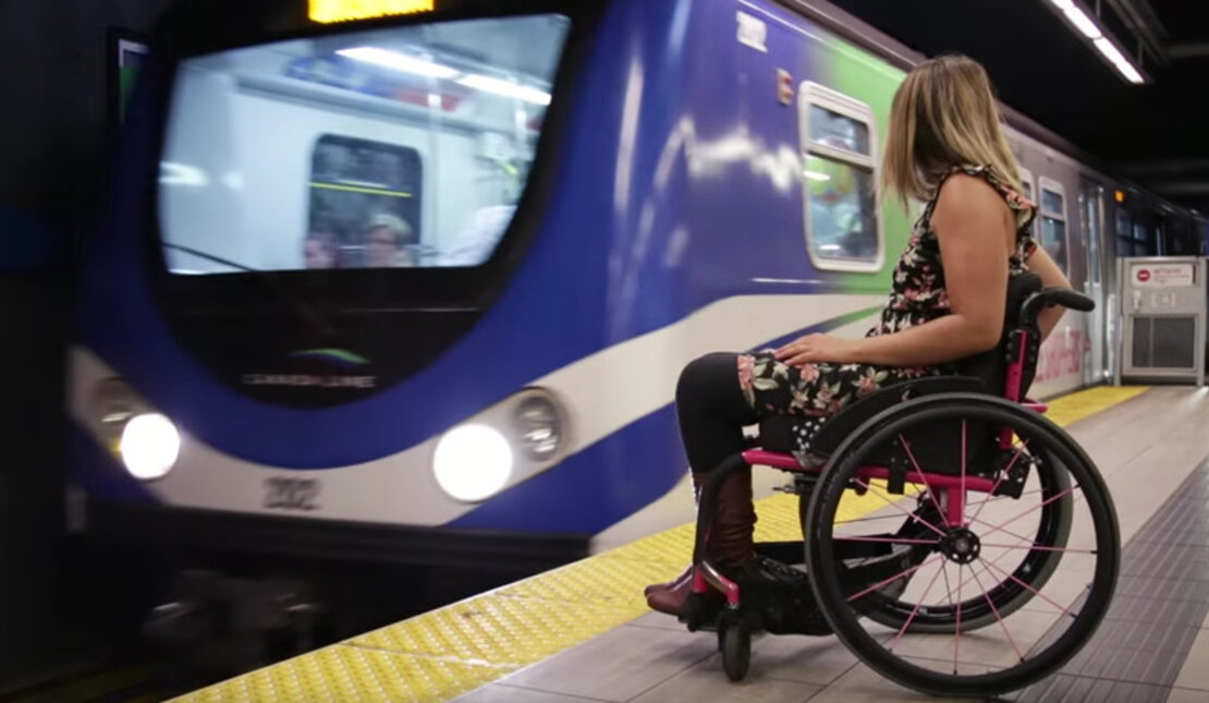 Person with disability waiting for train