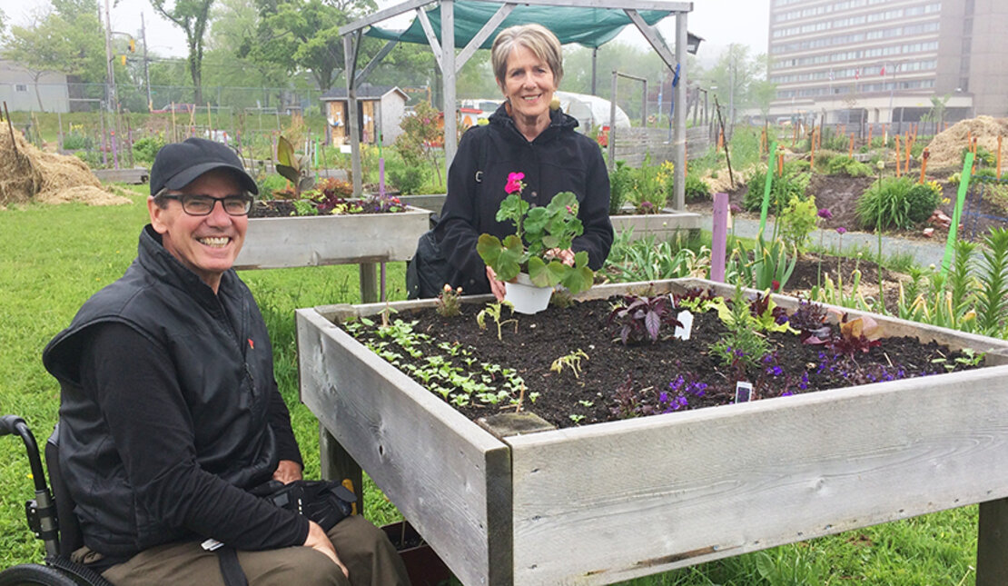 Two gardeners at Common Roots urban Farm in Halifax, Nova Scotia