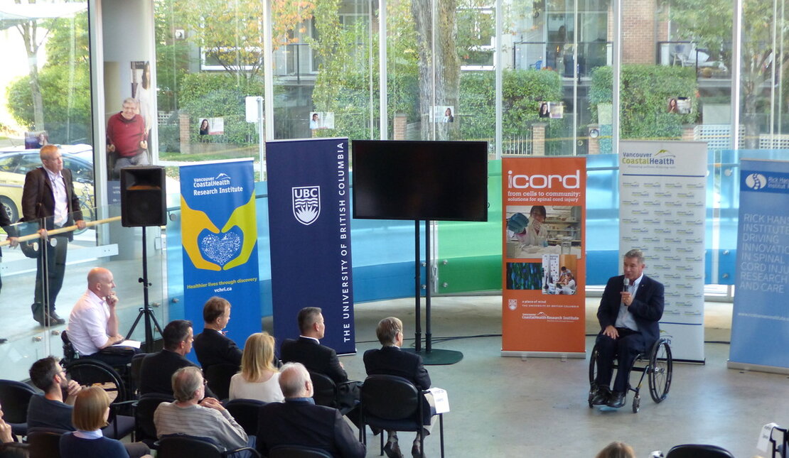 Rick Hansen giving a speech to a crowd