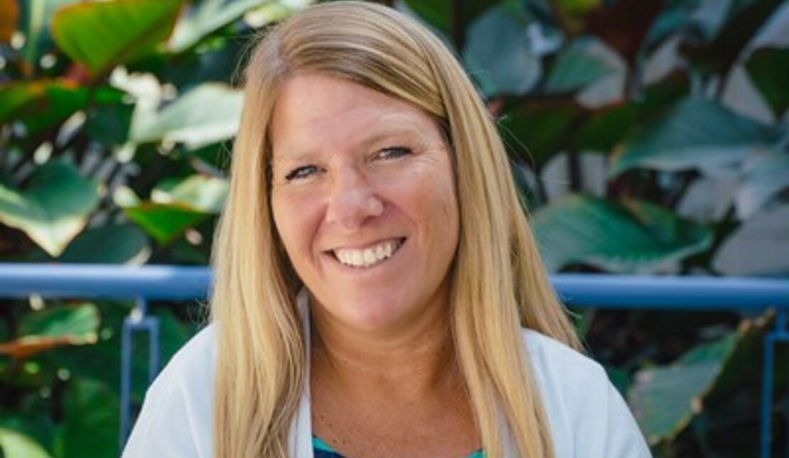 Michelle who has long blonde hair. Blue background. White text reads "You can make a big difference to so many people."