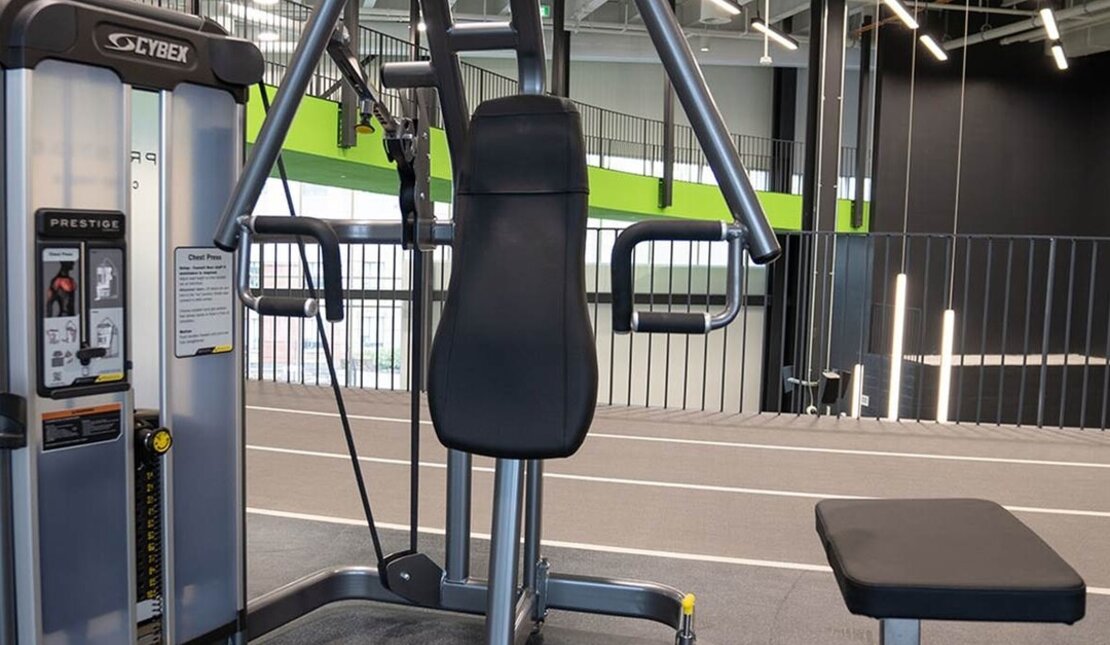 A gym machine with space to accommodate a mobility aid