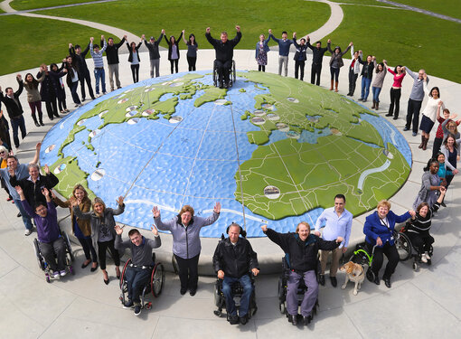 Rick Hansen Foundation staff at Larry Berg Flight Path Park globe