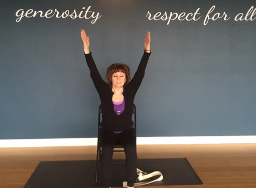 A woman does yoga indoors