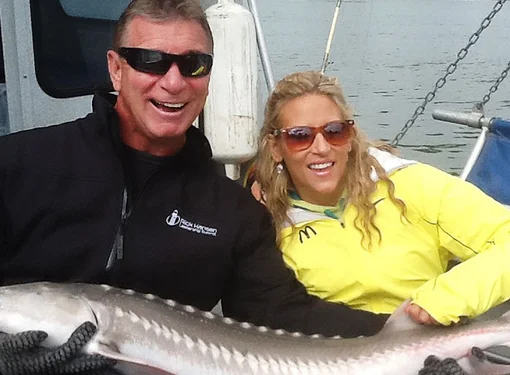 Rick Hansen and Jennifer Gabrysh hold large Sturgeon