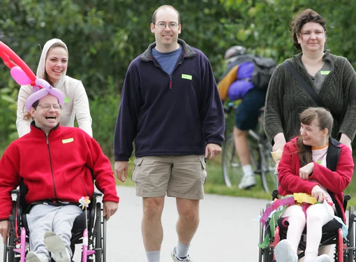 Inclusive group of people with and without disabilities outdoors