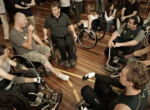 Rick and group of people talking in wheelchairs