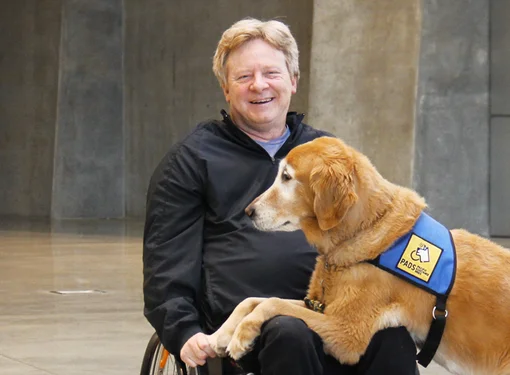 Brad McCannell and his service dog Chipper
