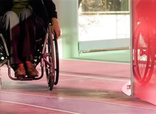 Waist down of a person with disability in a wheelchair