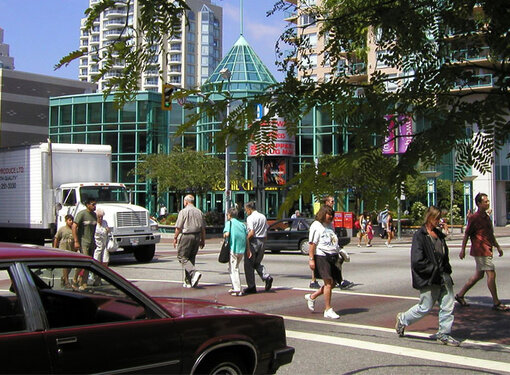 People crossing crosswalk in New Westminster on a sunny day