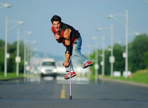 RHF Ambassador, Luca Lazylegz Patuelli in the middle of the street with incoming cars